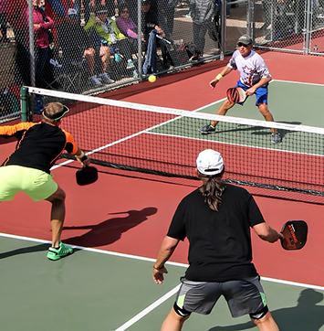Streetwise IR business news on Pickleball (image of players in pickleball match).