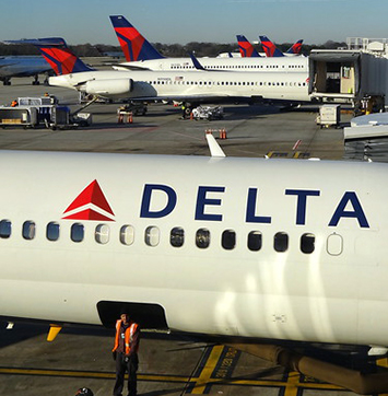 Image of Delta Airlines planes at airport gates in Atlanta.