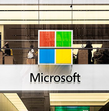 Image of Microsoft logo on building.