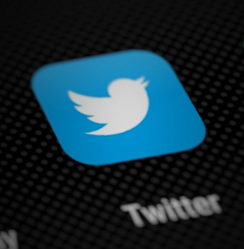 Close up image of Twitter logo on smartphone screen.