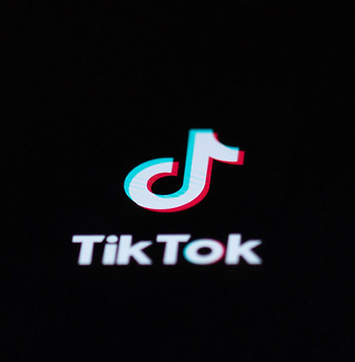 Image of TikTok logo on black background.