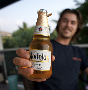 Image of person holding bottle of Modelo Especial beer.