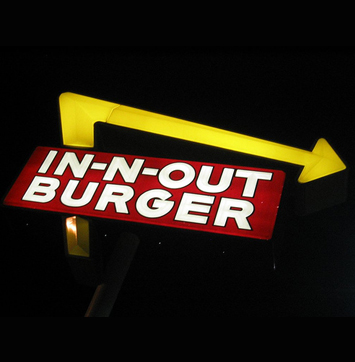 Image of In-N-Out Burger signage at night.