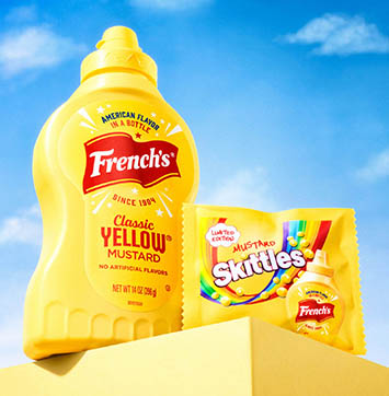 Image of bottle of French's Mustard and bag of Mustard Skittles.