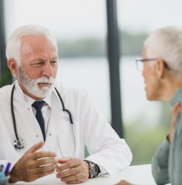 Image of doctor consulting with patient.