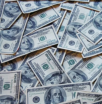 Image of $100 US bills on background.